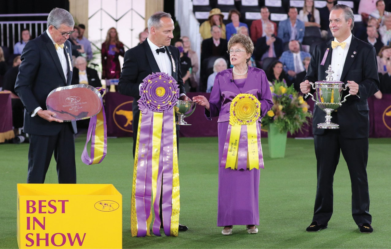 Judge Patricia Craige Trotter speaks to the crowd before awarding Best in Show. L/R David A. Heming, David W. Haddock, and Charlton Reynders, III.