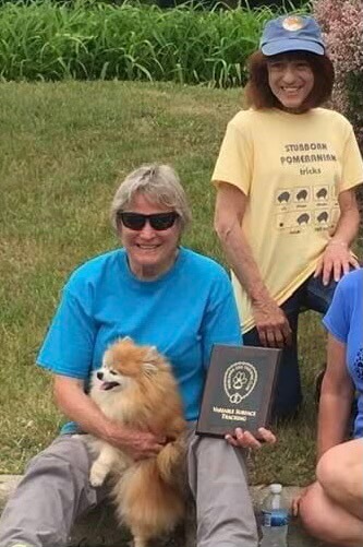  CT ‘Trevor,’ the Pomeranian, proves that any breed can track. He is the first (and probably only) Champion Tracking Dog in the AKC registry. Also pictured are Handler Penny Kurz and Owner Paulette Zecca.