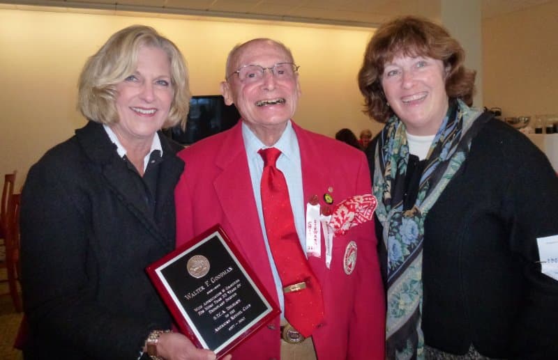Taken in 2012 at his last Montgomery County KC show, then Skye Terrier Club of America President and Judges Education Committee Member Karen Turnbull, on the left, and Karen Sanders, STCA Secretary and Judges Education Committee Member, on the right, present Walter Goodman with a special award of appreciation from the club for his many years of service as our AKC Delegate.