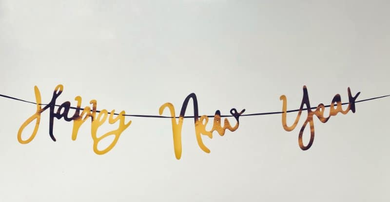 Text in cursive that says: "happy new year"