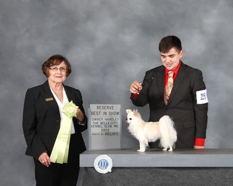 Bryant Janetzke with his Chihuahua at a dog show podium