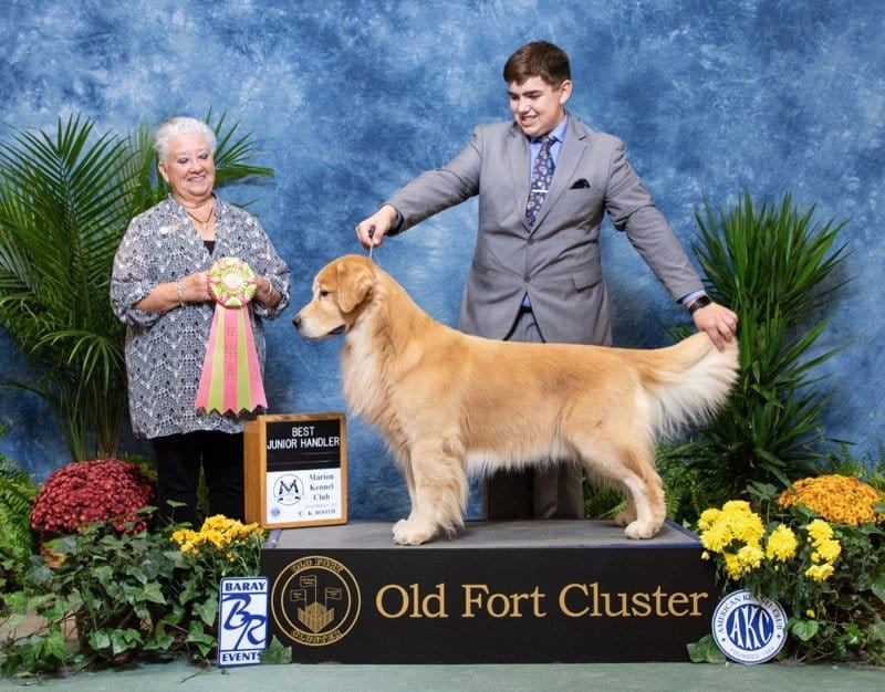 Bryant Janetzke with his Golden Retriever at a dog show