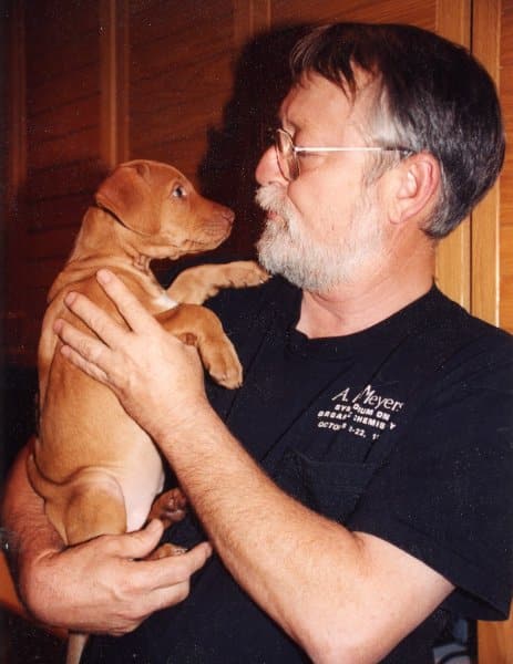 Clayton Heathcock. holding a Camelot Rhodesian Ridgeback puppy