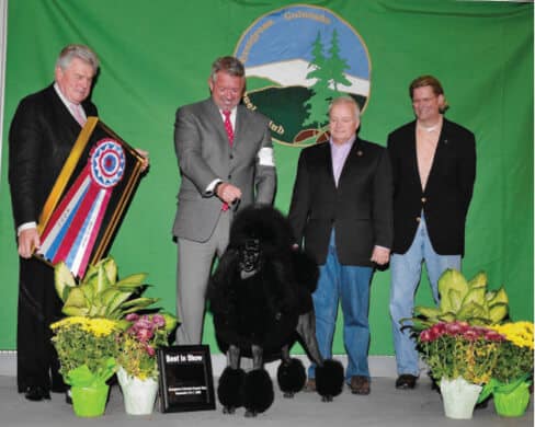 Dennis and Randy’s Poodle ‘Yessie’ (top-winning black Poodle in history with 103 All-Breed BIS) with Dr. Richard Mean
