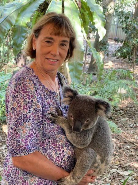 Carol Sommerfelt holds a koala at the Lone Pine Koala Sanctuary in Brisbane.